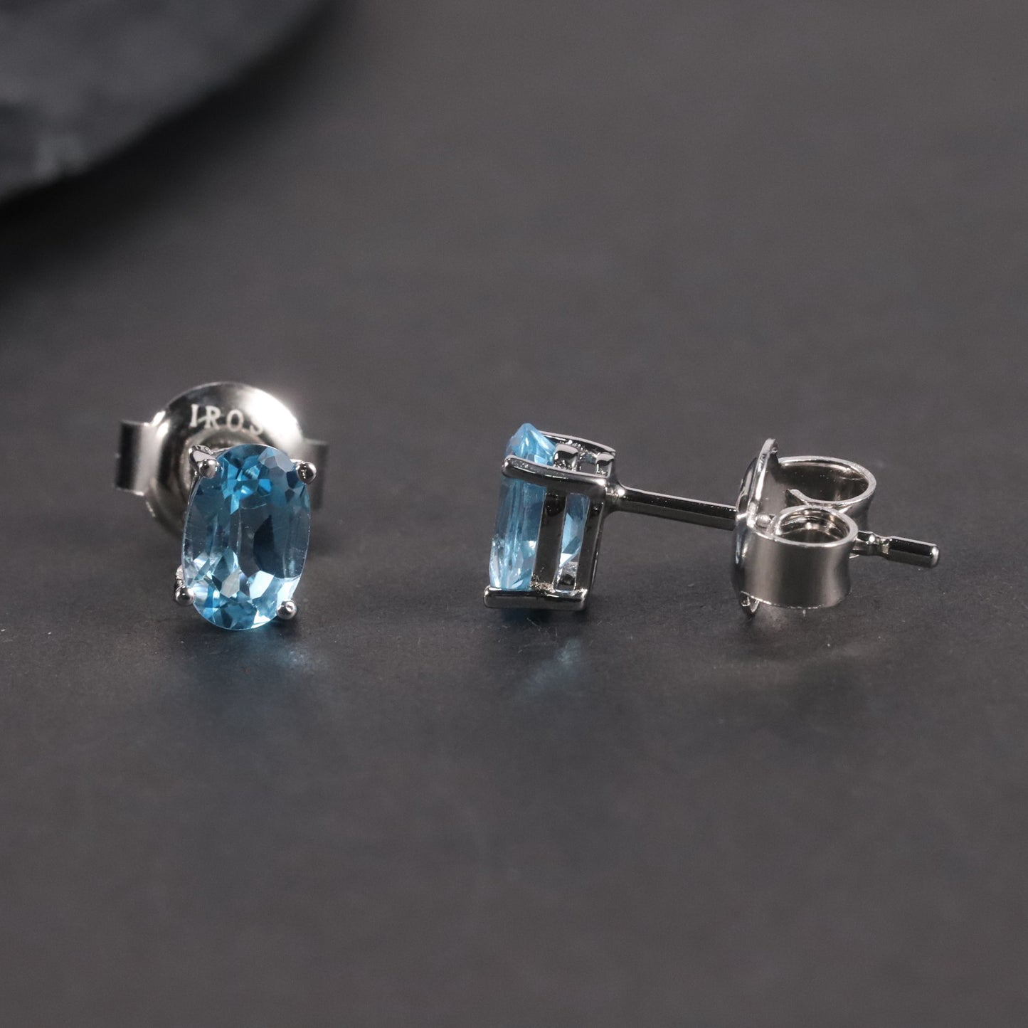 Oval Cut Stud Earrings in Sterling Silver -  Swiss Blue Topaz